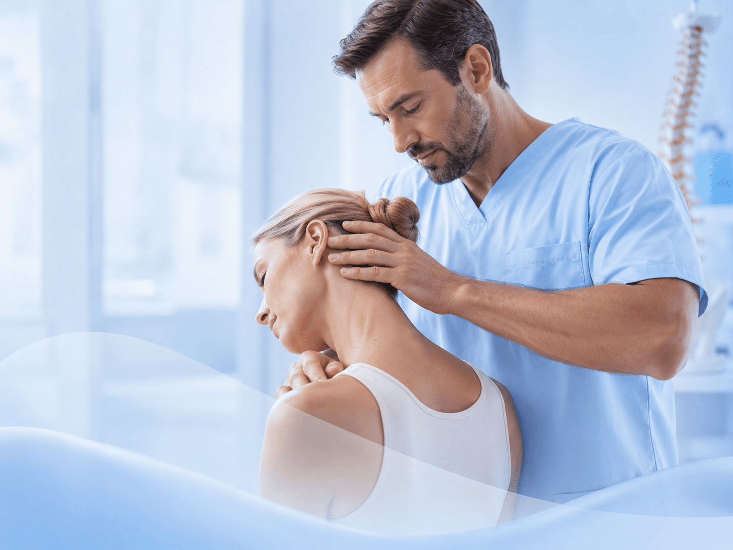 Therapist working with a patient during spine therapy